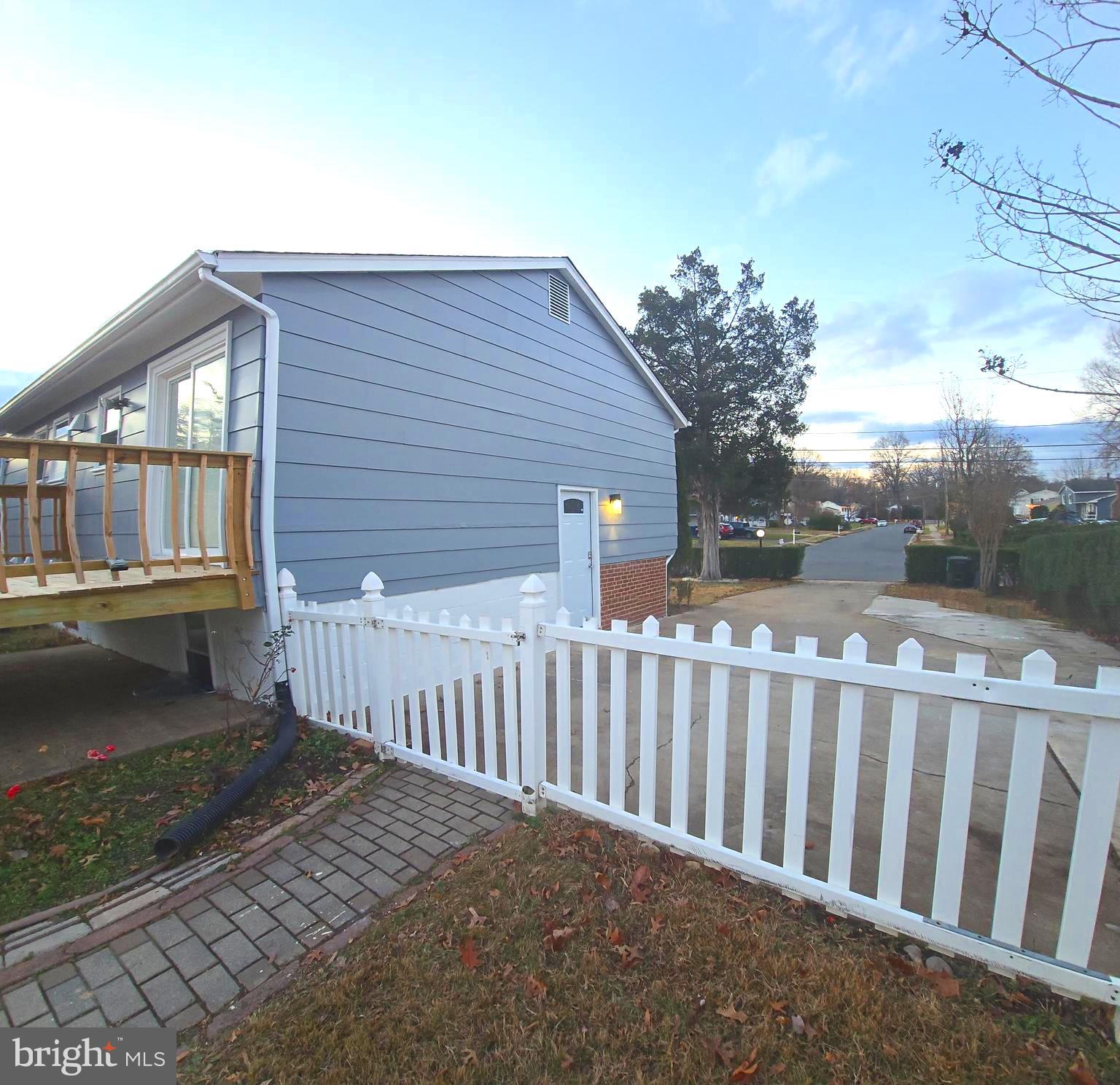 4813 Lawrence Street Alexandria, VA 22309 - Photo 62 of 66 a view of a house with a small yard and wooden fence