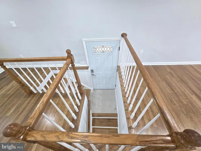 a view of entryway with wooden floor