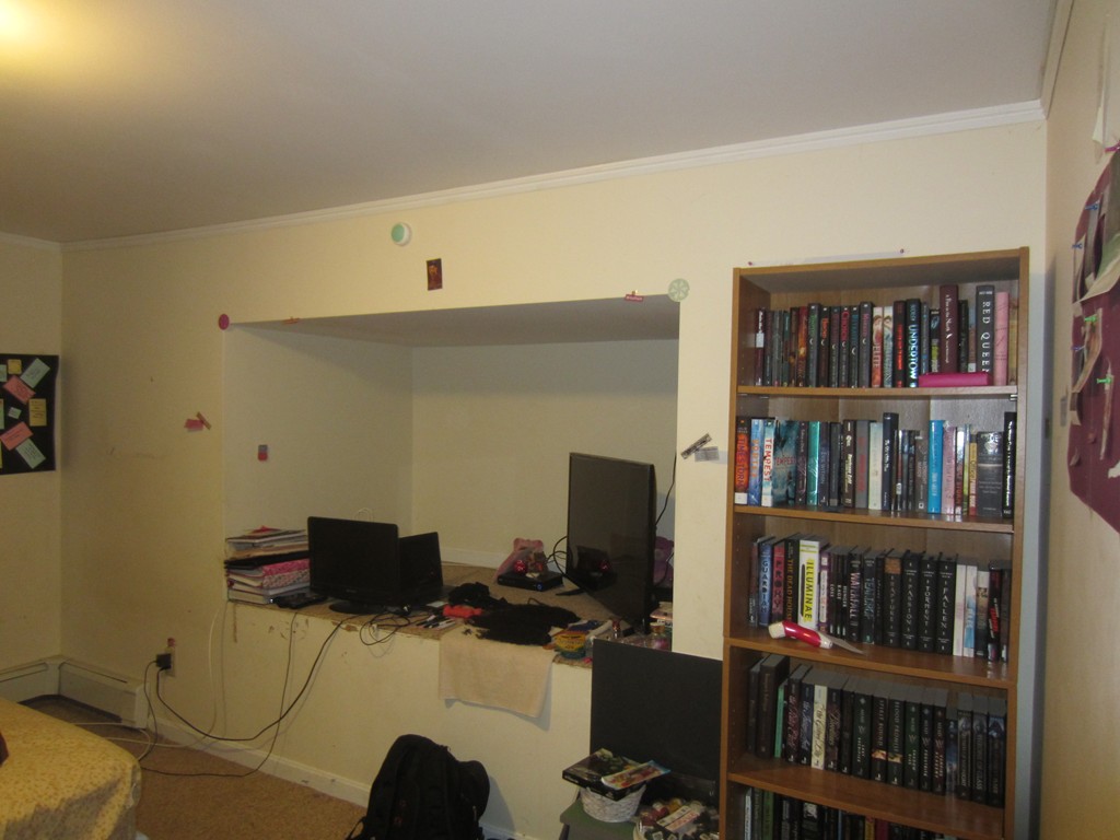 299-301 Winslow Gray Road Yarmouth, MA 02673 - Photo 11 of 15 a view of a workspace with a bookshelf