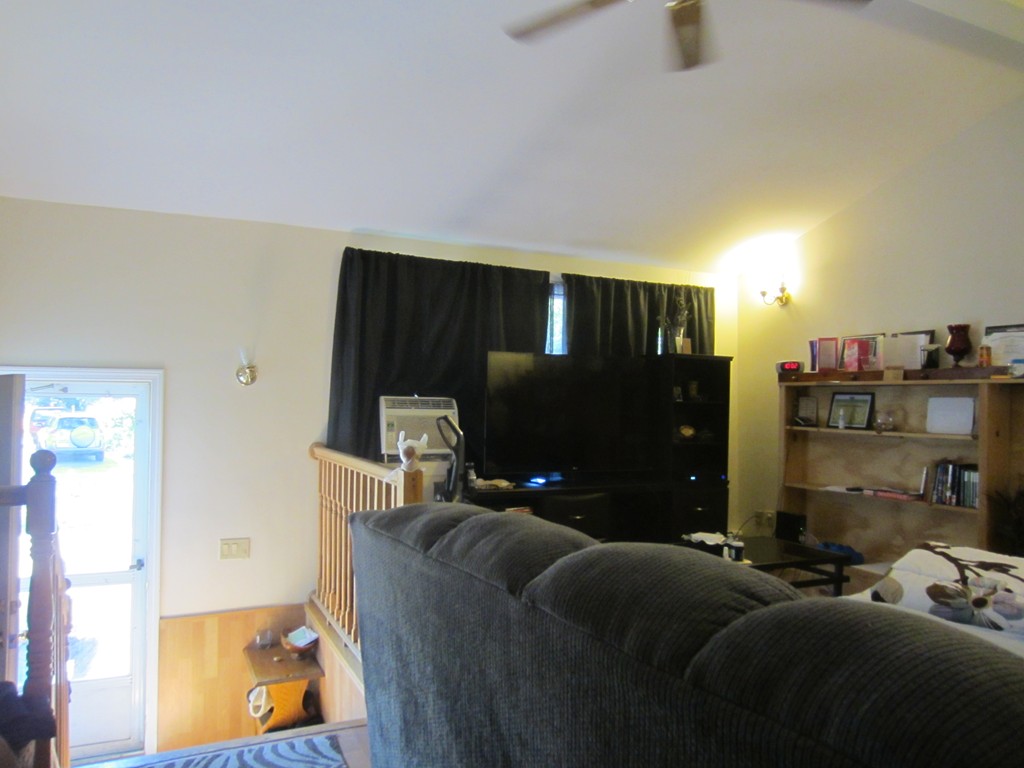 299-301 Winslow Gray Road Yarmouth, MA 02673 - Photo 12 of 15 a living room with furniture and a flat screen tv