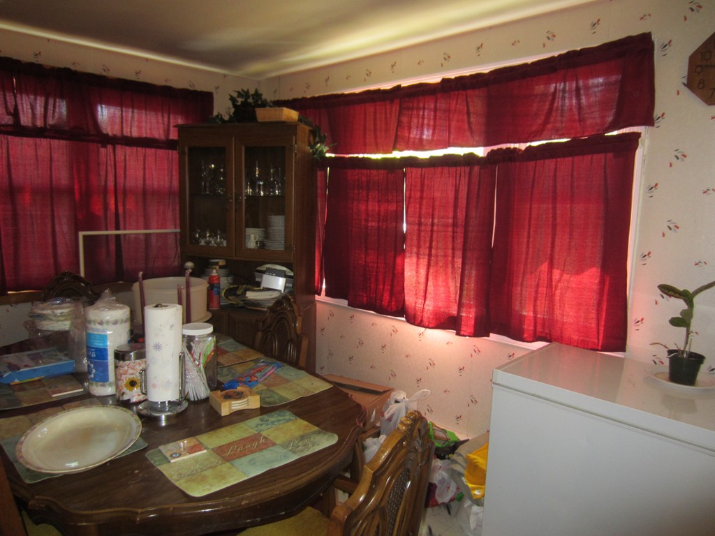 299-301 Winslow Gray Road Yarmouth, MA 02673 - Photo 14 of 15 a dinning table and chairs in a kitchen