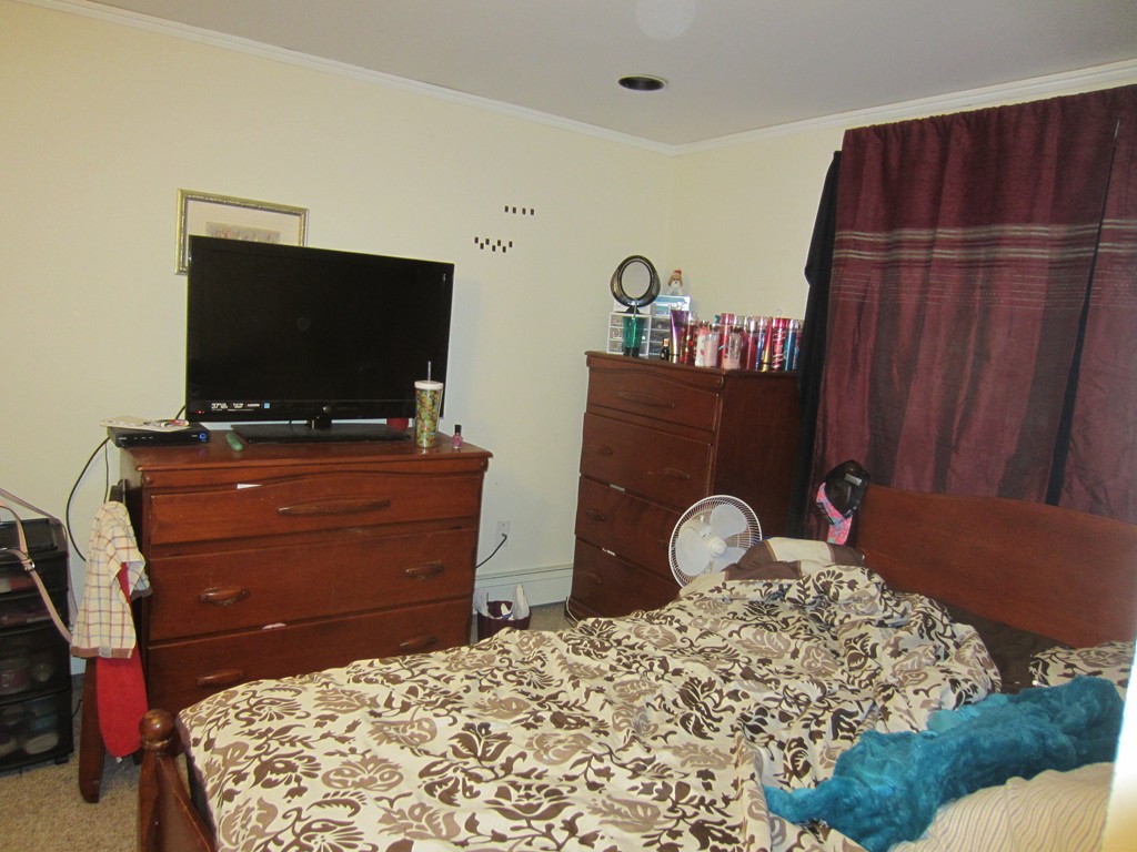 299-301 Winslow Gray Road Yarmouth, MA 02673 - Photo 15 of 15 a bed room with a bed and a television