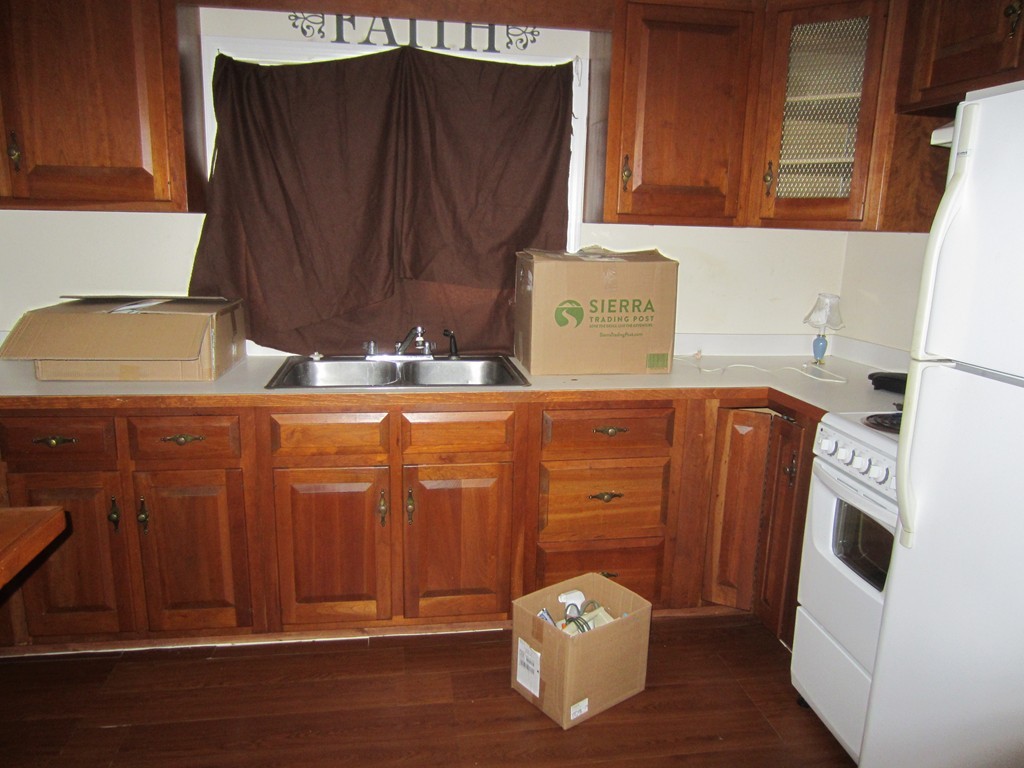 299-301 Winslow Gray Road Yarmouth, MA 02673 - Photo 5 of 15 a view of a storage and utility room with wooden floor