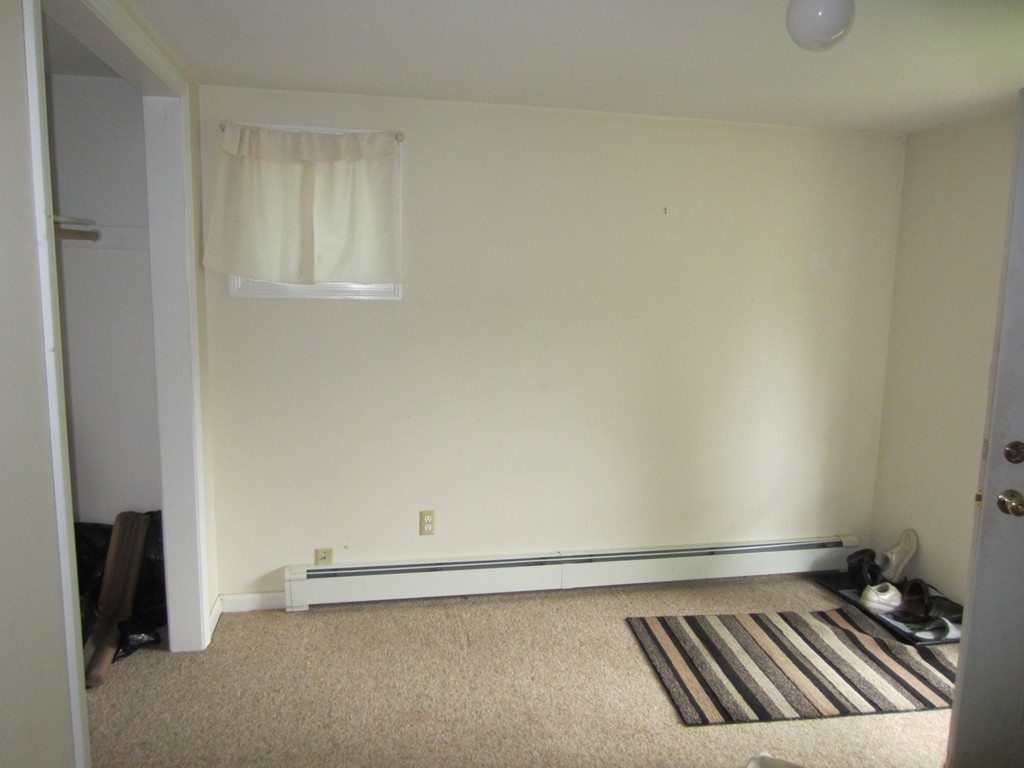 299-301 Winslow Gray Road Yarmouth, MA 02673 - Photo 8 of 15 a view of an empty room and wooden floor