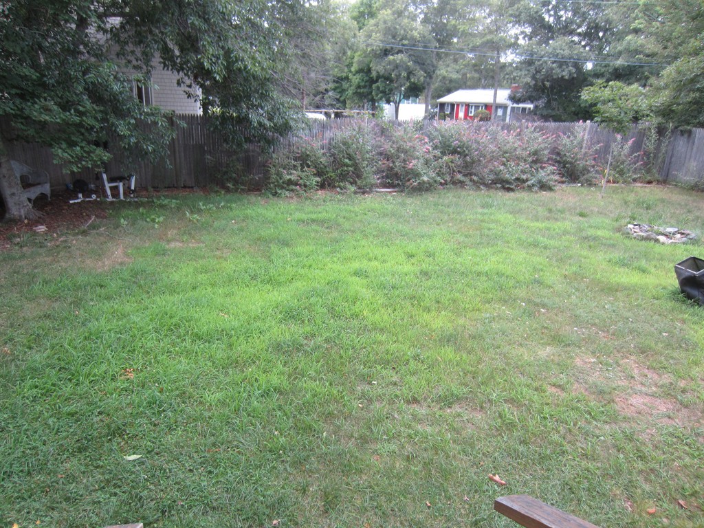 299-301 Winslow Gray Road Yarmouth, MA 02673 - Photo 10 of 15 a view of a back yard