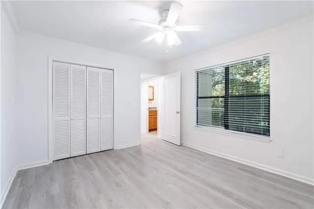 a bathroom with a granite countertop sink a toilet and bathtub