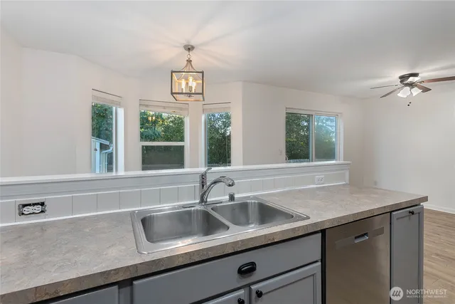 a kitchen with a sink and a window