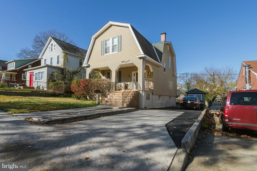 5014 Morello Road Baltimore, MD 21214 - Photo 2 of 29 a front view of a house with a garden