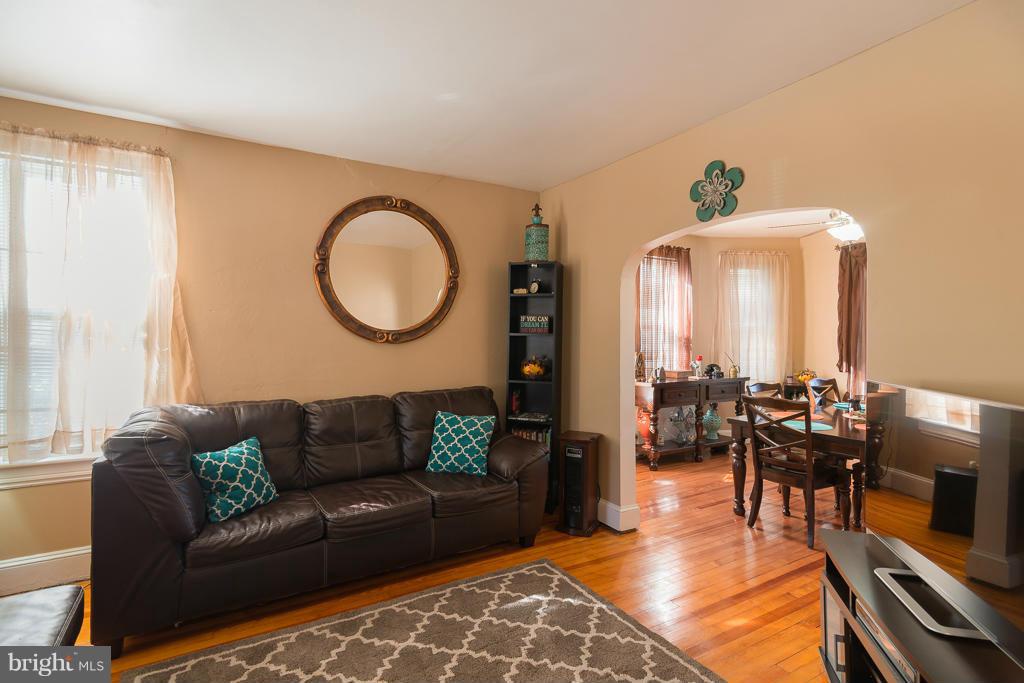 5014 Morello Road Baltimore, MD 21214 - Photo 13 of 29 a living room with furniture and wooden floor