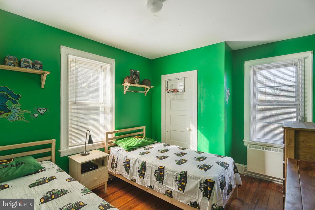 5014 Morello Road Baltimore, MD 21214 - Photo 18 of 29 a bedroom with a bed and windows