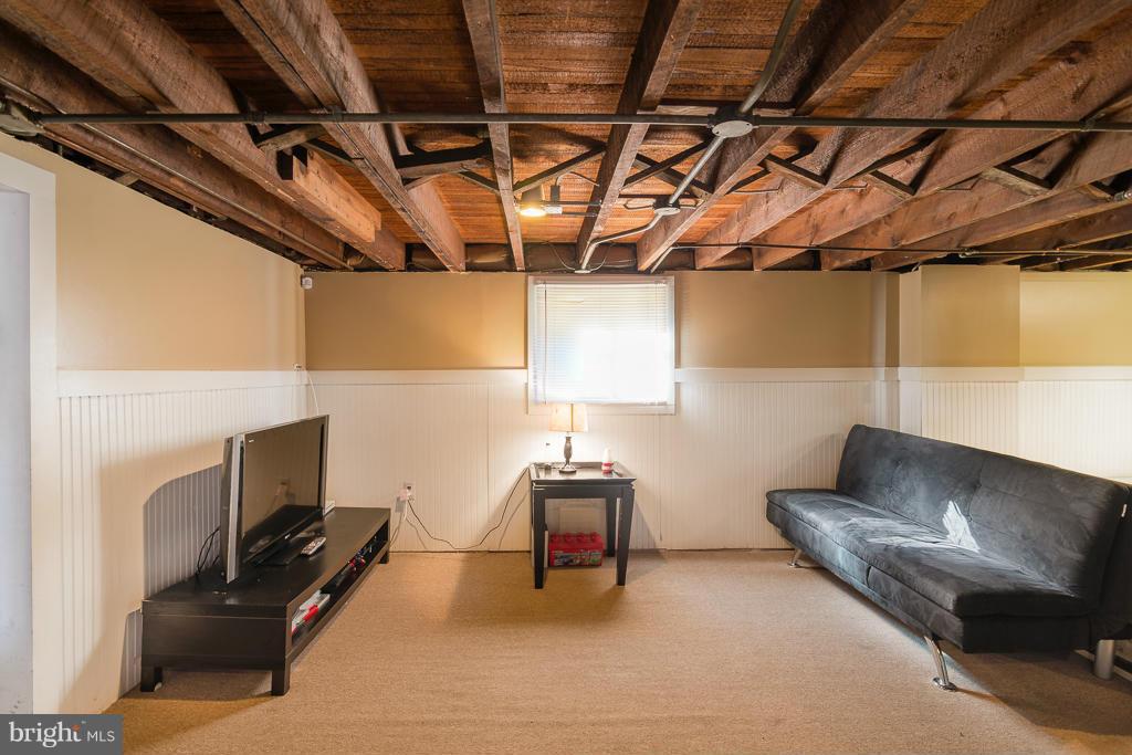 5014 Morello Road Baltimore, MD 21214 - Photo 20 of 29 a living room with furniture and a flat screen tv