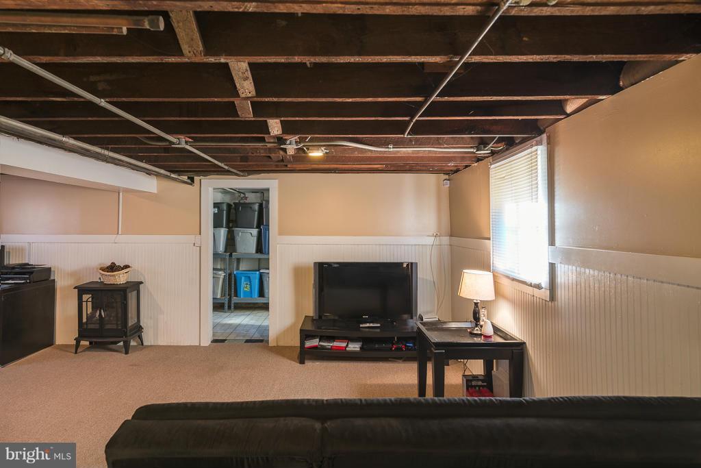5014 Morello Road Baltimore, MD 21214 - Photo 22 of 29 a living room with furniture and a fireplace