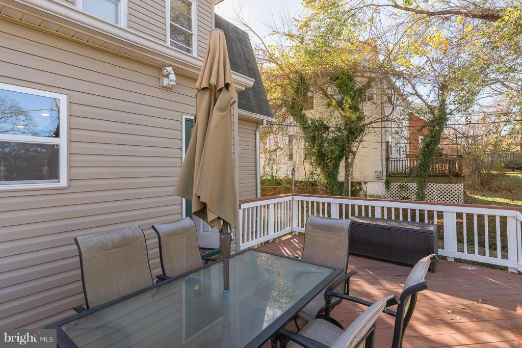 5014 Morello Road Baltimore, MD 21214 - Photo 23 of 29 a view of balcony with wooden floor and outdoor seating