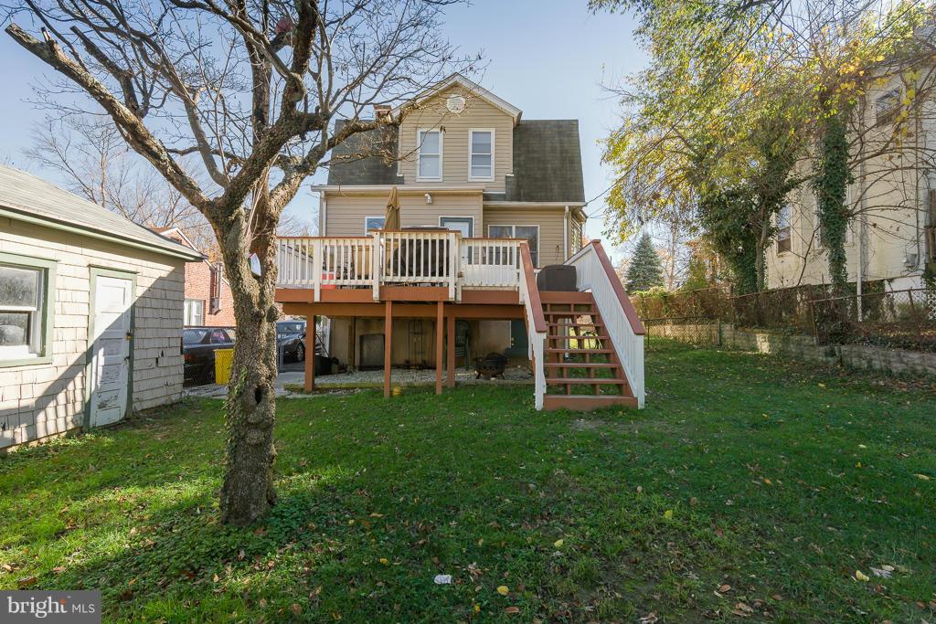 5014 Morello Road Baltimore, MD 21214 - Photo 25 of 29 a view of a house with a big yard and large trees
