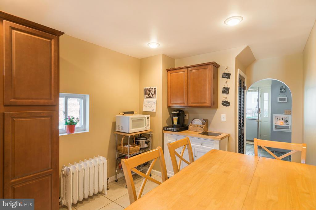 5014 Morello Road Baltimore, MD 21214 - Photo 6 of 29 a bedroom with a bed and wooden floor