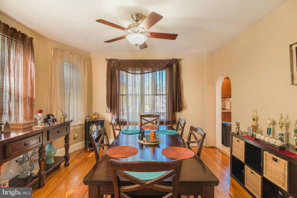 5014 Morello Road Baltimore, MD 21214 - Photo 9 of 29 a view of a dining room with furniture window and wooden floor