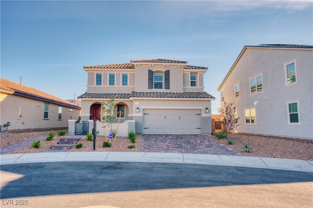 3777 Alla Rocca Avenue Henderson, NV 89044 - Photo 1 of 55 Mediterranean / spanish-style home featuring stucco siding, driveway, a garage, and a tiled roof