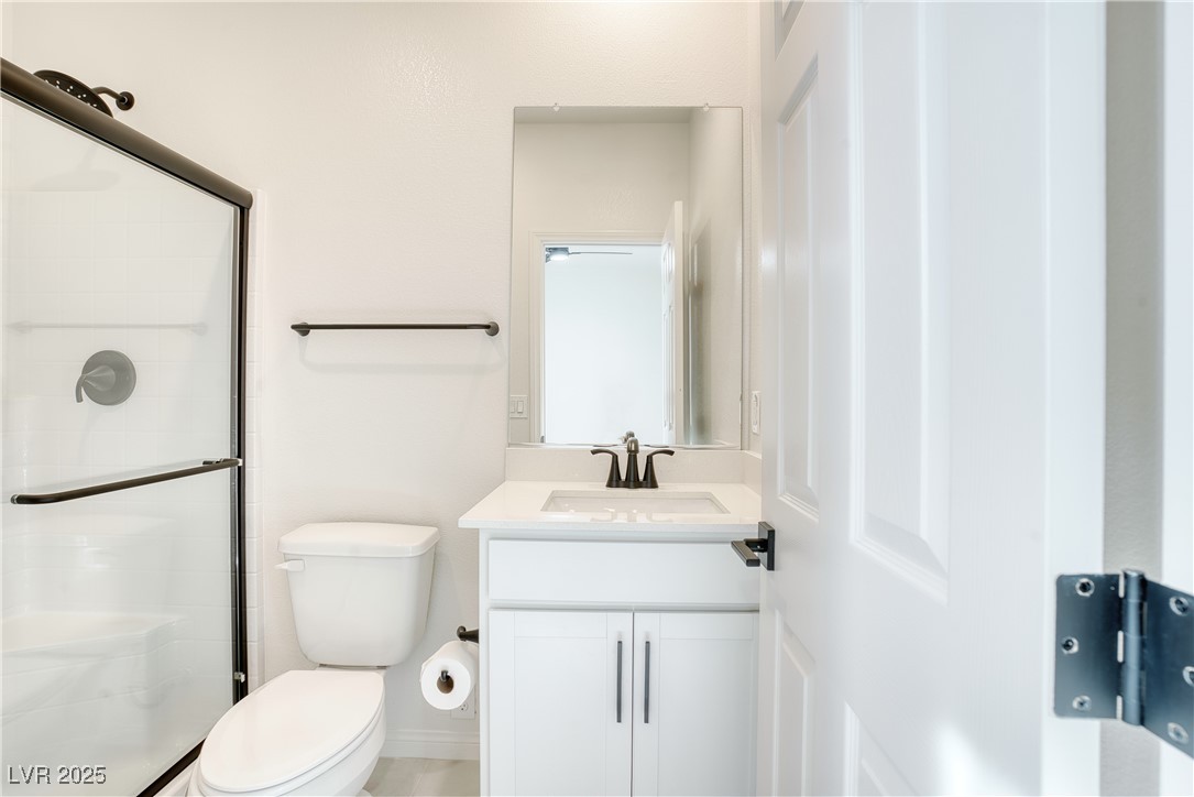 3777 Alla Rocca Avenue Henderson, NV 89044 - Photo 18 of 55 Bathroom featuring a stall shower and vanity, downstairs