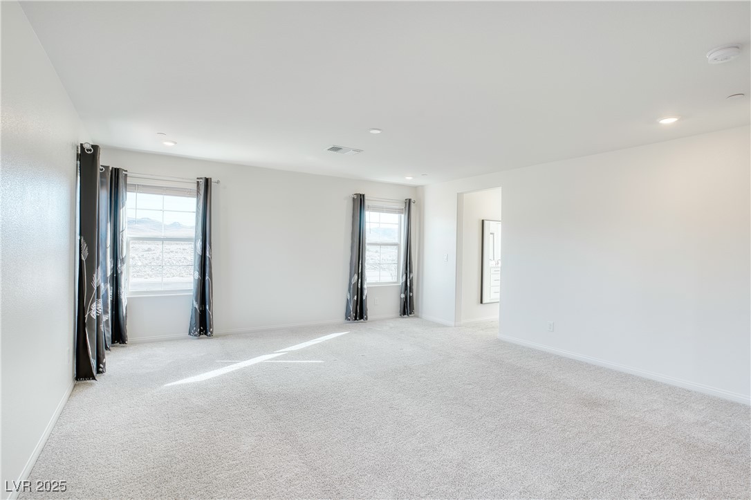 3777 Alla Rocca Avenue Henderson, NV 89044 - Photo 23 of 55 Carpeted spare room featuring baseboards and recessed lighting