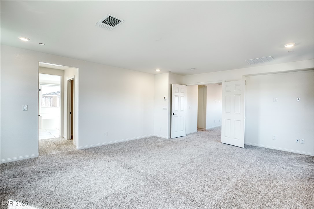 3777 Alla Rocca Avenue Henderson, NV 89044 - Photo 24 of 55 Unfurnished bedroom featuring light carpet and recessed lighting