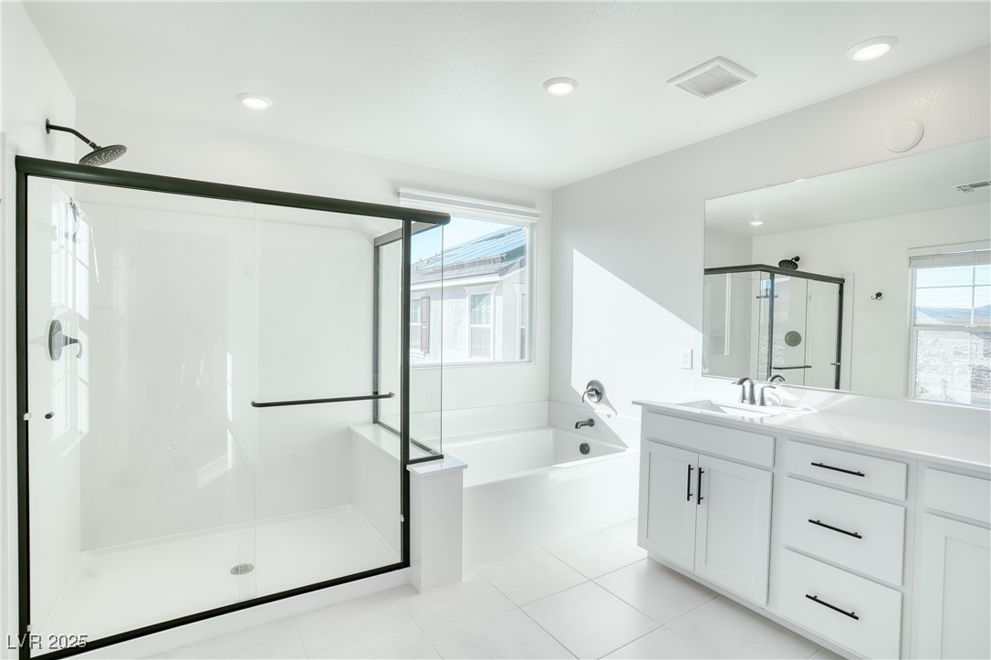 3777 Alla Rocca Avenue Henderson, NV 89044 - Photo 25 of 55 Bathroom with a stall shower, vanity, a bath, light tile patterned floors, and recessed lighting