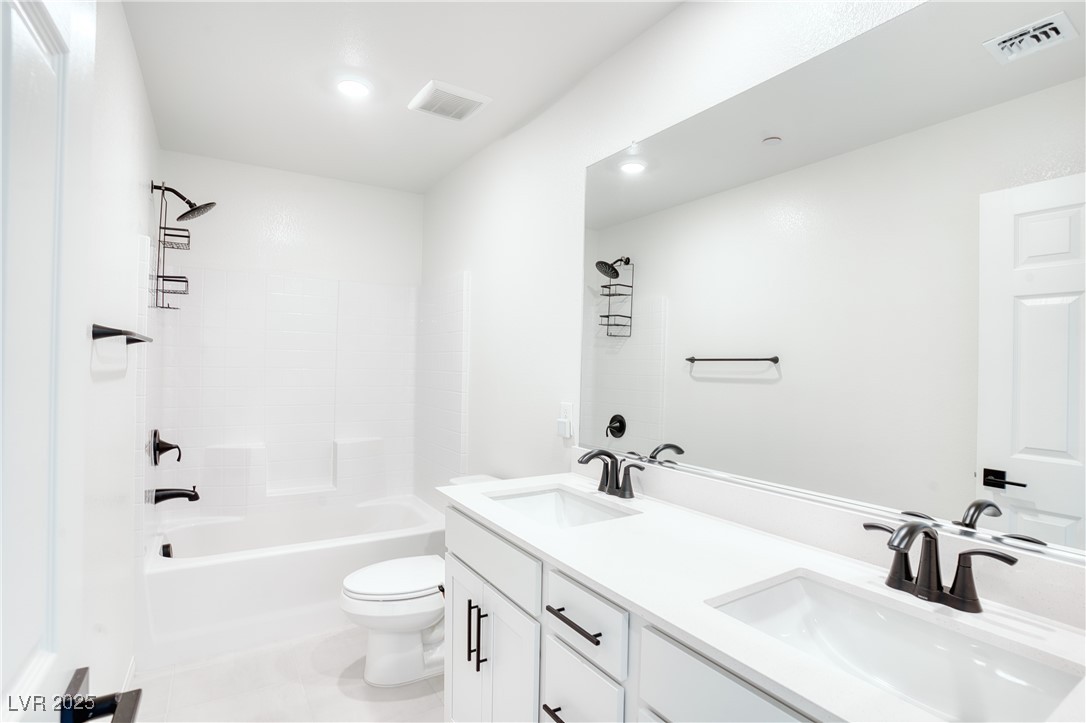 3777 Alla Rocca Avenue Henderson, NV 89044 - Photo 30 of 55 Full bathroom featuring shower / bath combination, double vanity, and light tile patterned floors