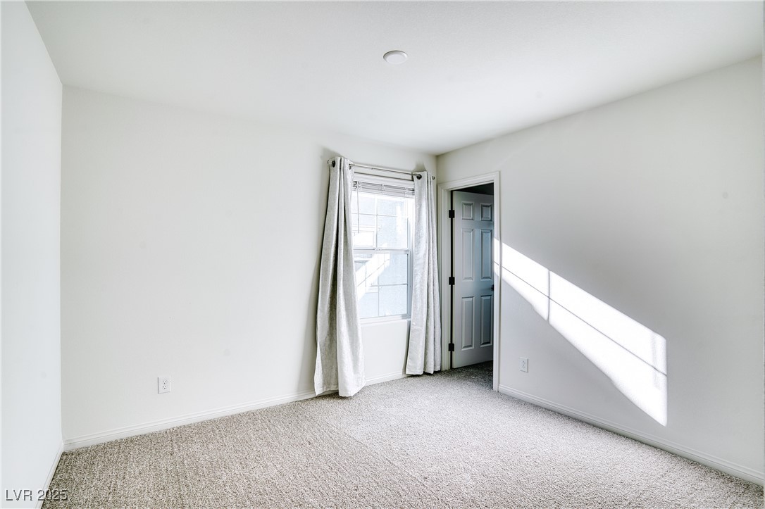 3777 Alla Rocca Avenue Henderson, NV 89044 - Photo 31 of 55 Carpeted spare room with baseboards