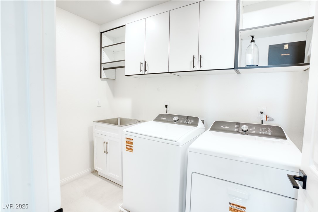 3777 Alla Rocca Avenue Henderson, NV 89044 - Photo 35 of 55 Laundry area featuring cabinet space and washing machine and clothes dryer
