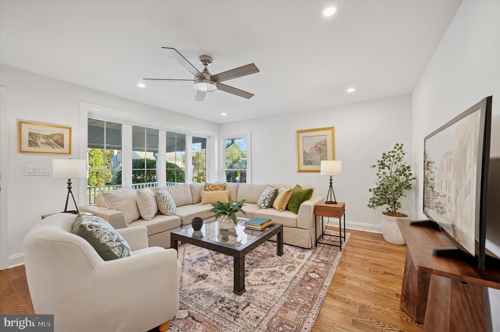 2308 Poplar Road Havertown, PA 19083 - Photo 5 of 25 a living room with furniture a large window and a flat screen tv