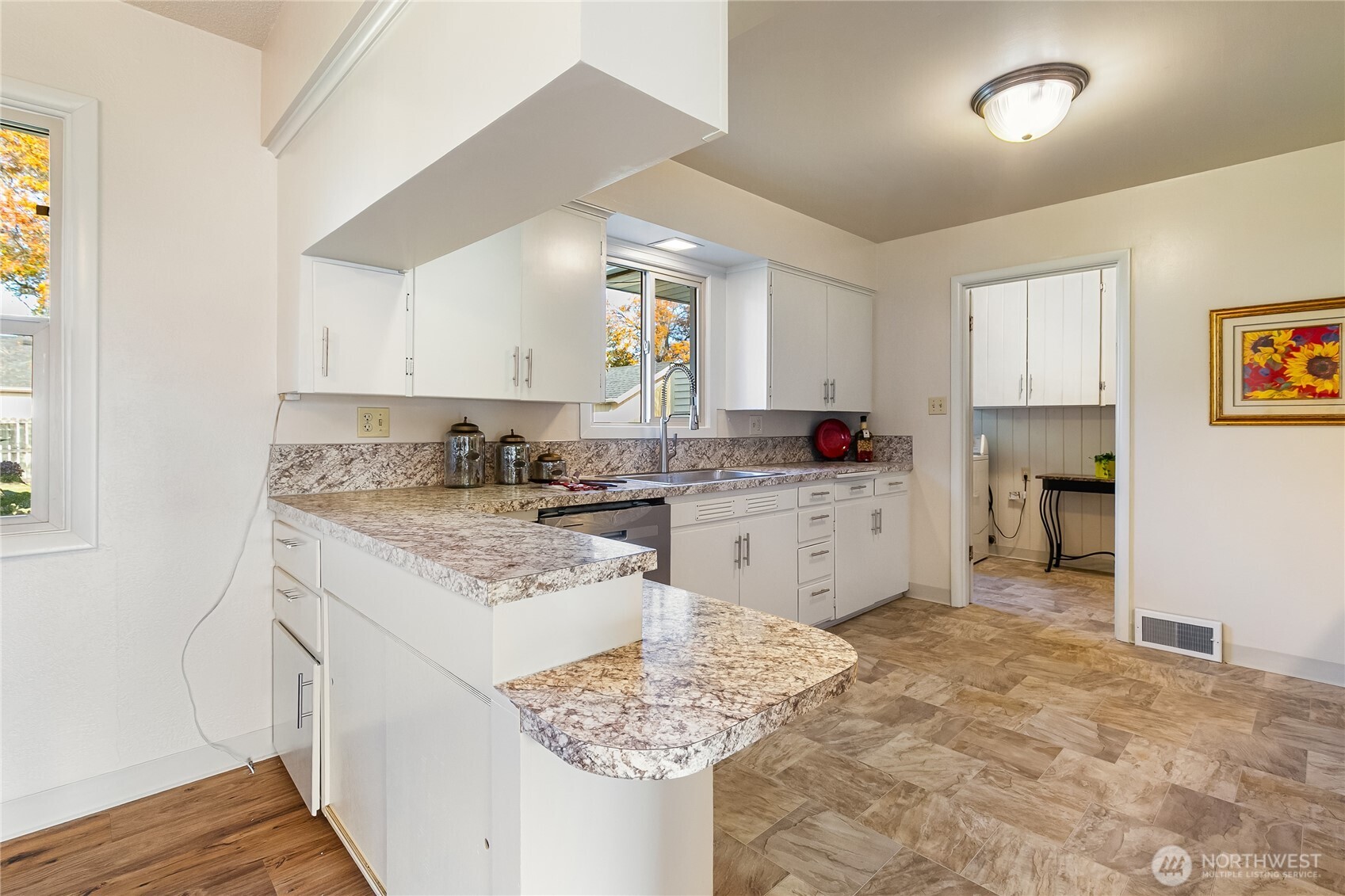 1510 E Street Lynden, WA 98264 - Photo 15 of 32 a kitchen with granite countertop a sink stove and cabinets