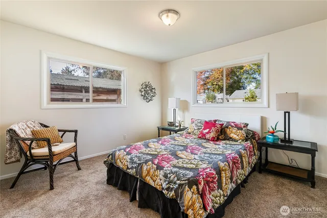 a bedroom with a bed and dresser