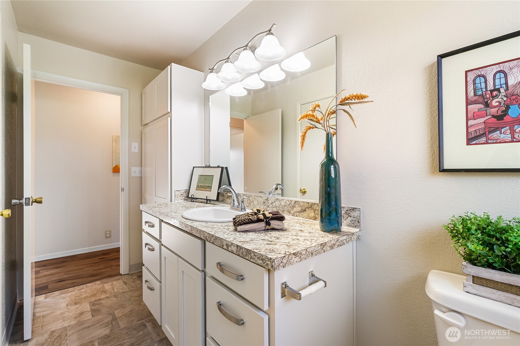 1510 E Street Lynden, WA 98264 - Photo 19 of 32 a bathroom with a granite countertop sink a toilet and a mirror