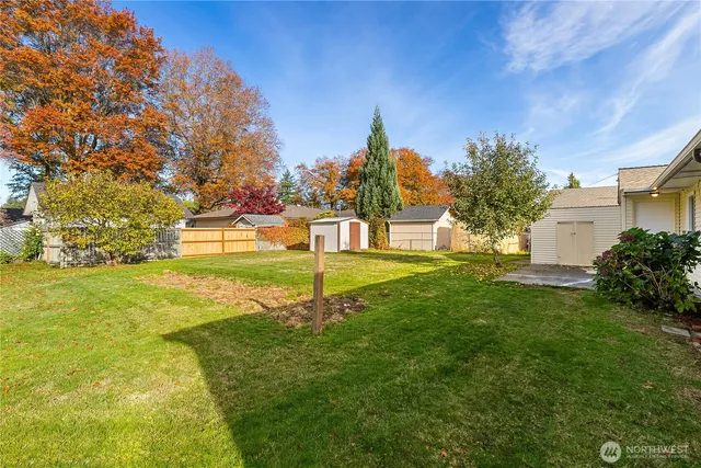 a view of yard with swimming pool