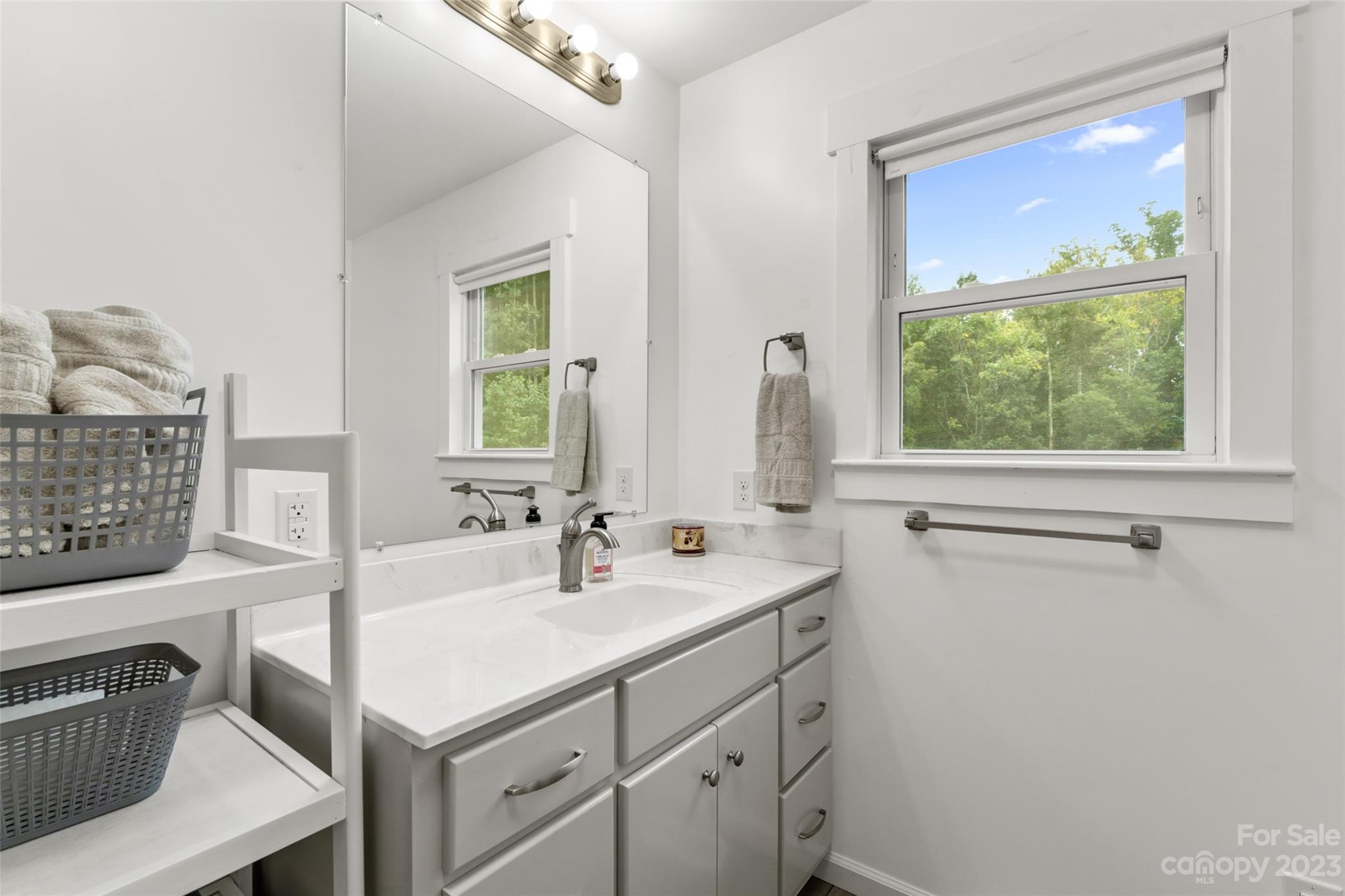 6363 Cheatham Ford Road Hiddenite, NC 28636 - Photo 13 of 32 a bathroom with a sink and a window