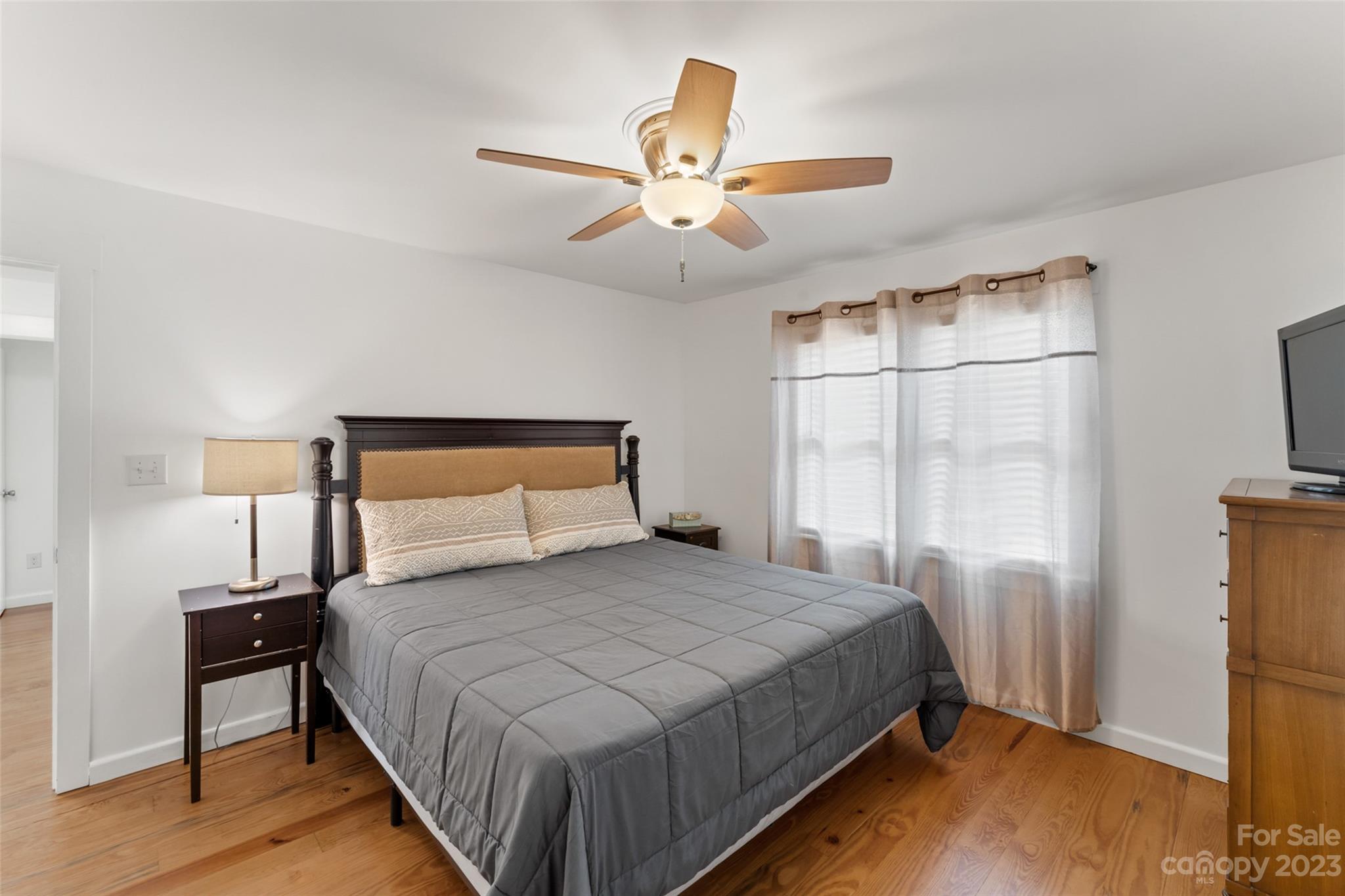 6363 Cheatham Ford Road Hiddenite, NC 28636 - Photo 15 of 32 a bedroom with a bed and a night stand