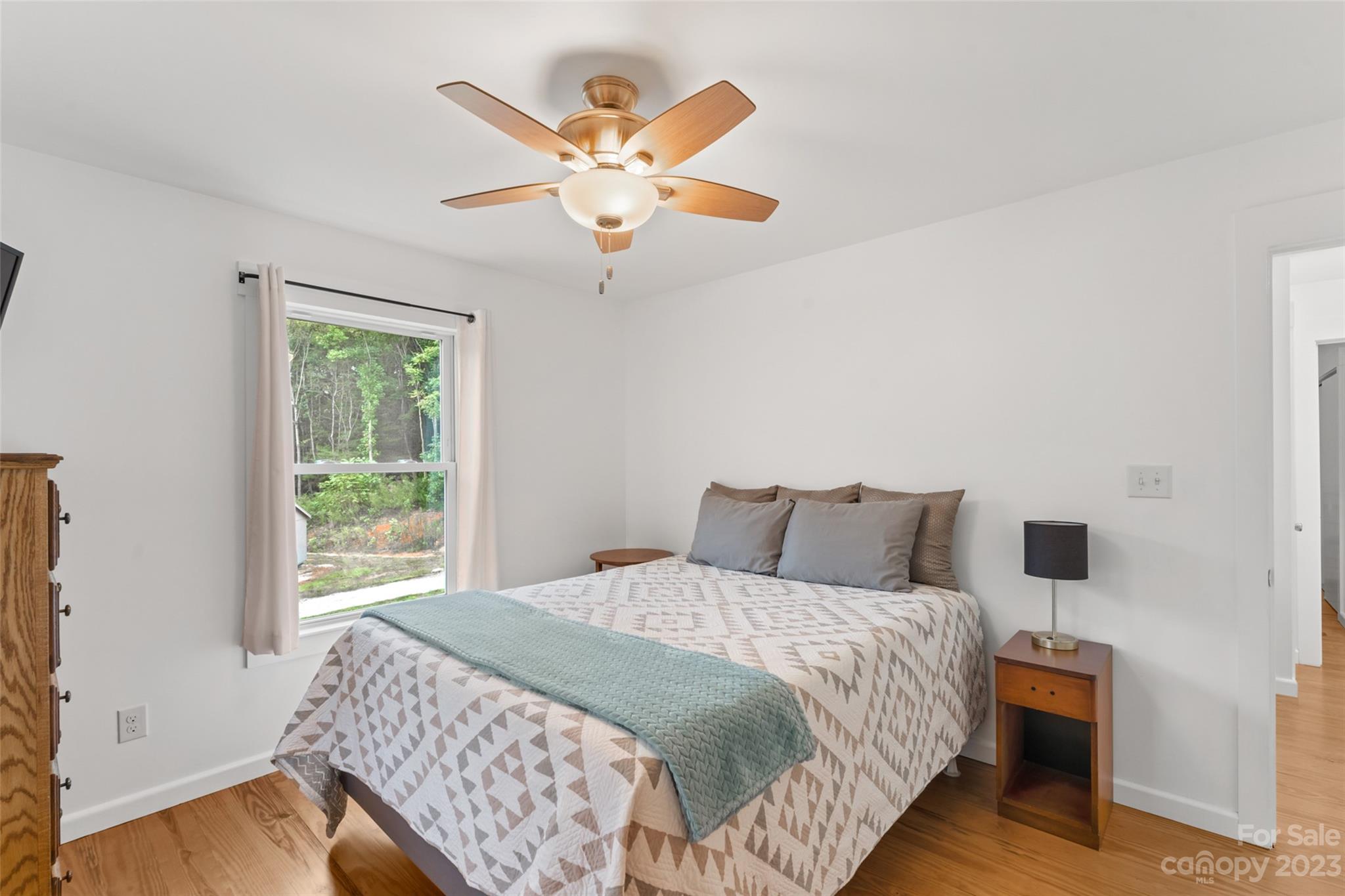 6363 Cheatham Ford Road Hiddenite, NC 28636 - Photo 18 of 32 a bedroom with a large bed and a window