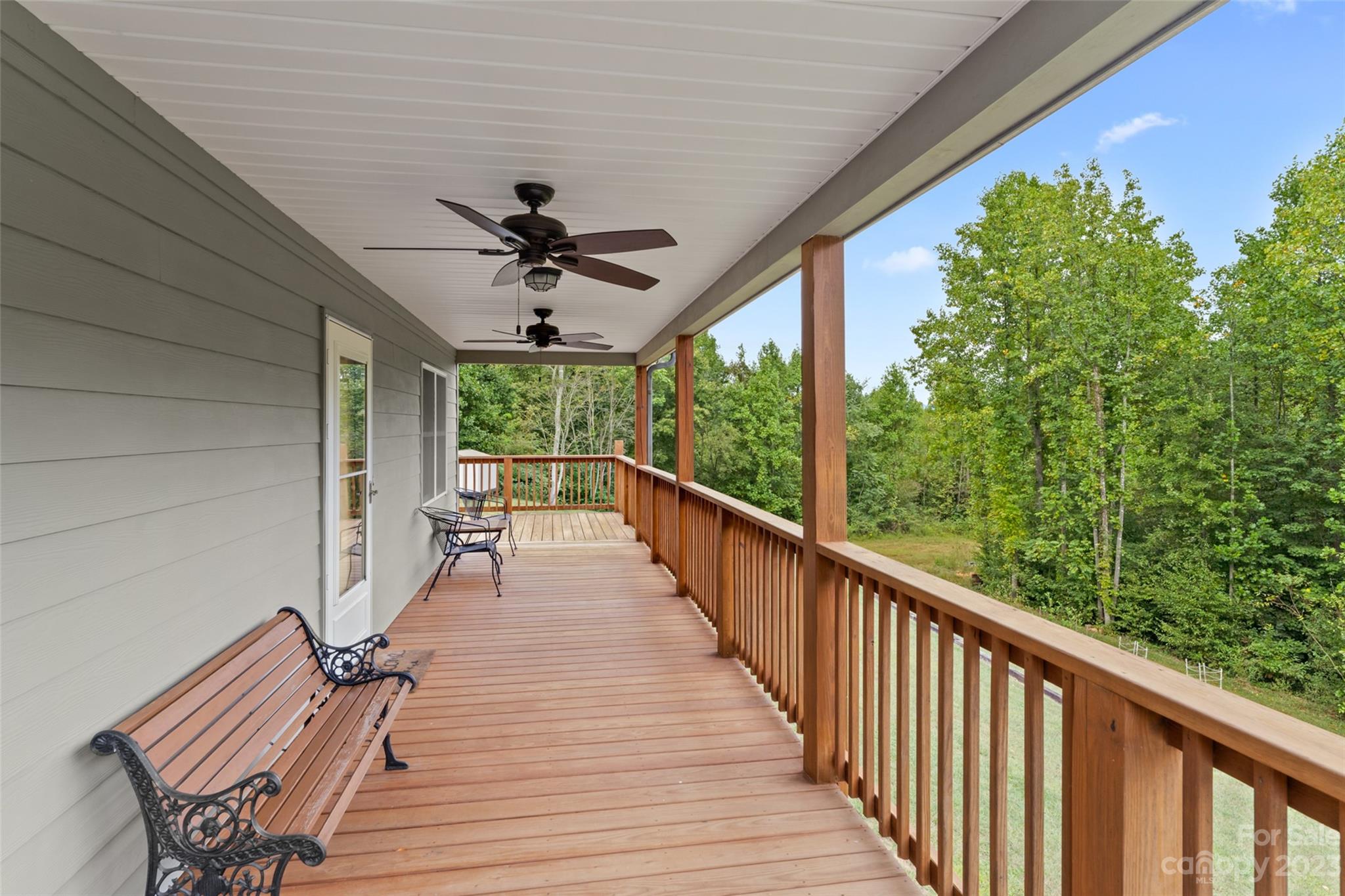 6363 Cheatham Ford Road Hiddenite, NC 28636 - Photo 2 of 32 a view of a porch with wooden floor and outdoor space