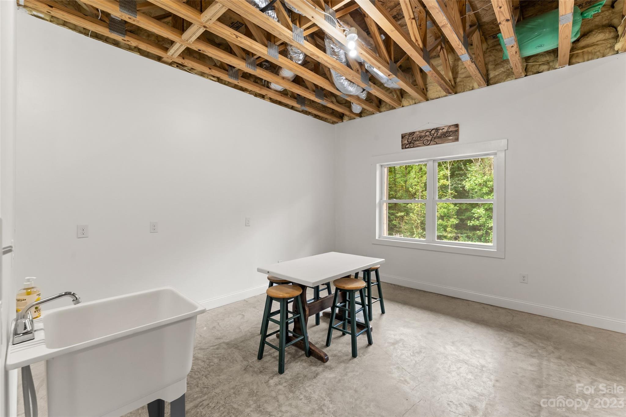 6363 Cheatham Ford Road Hiddenite, NC 28636 - Photo 22 of 32 a dining room with furniture and a window