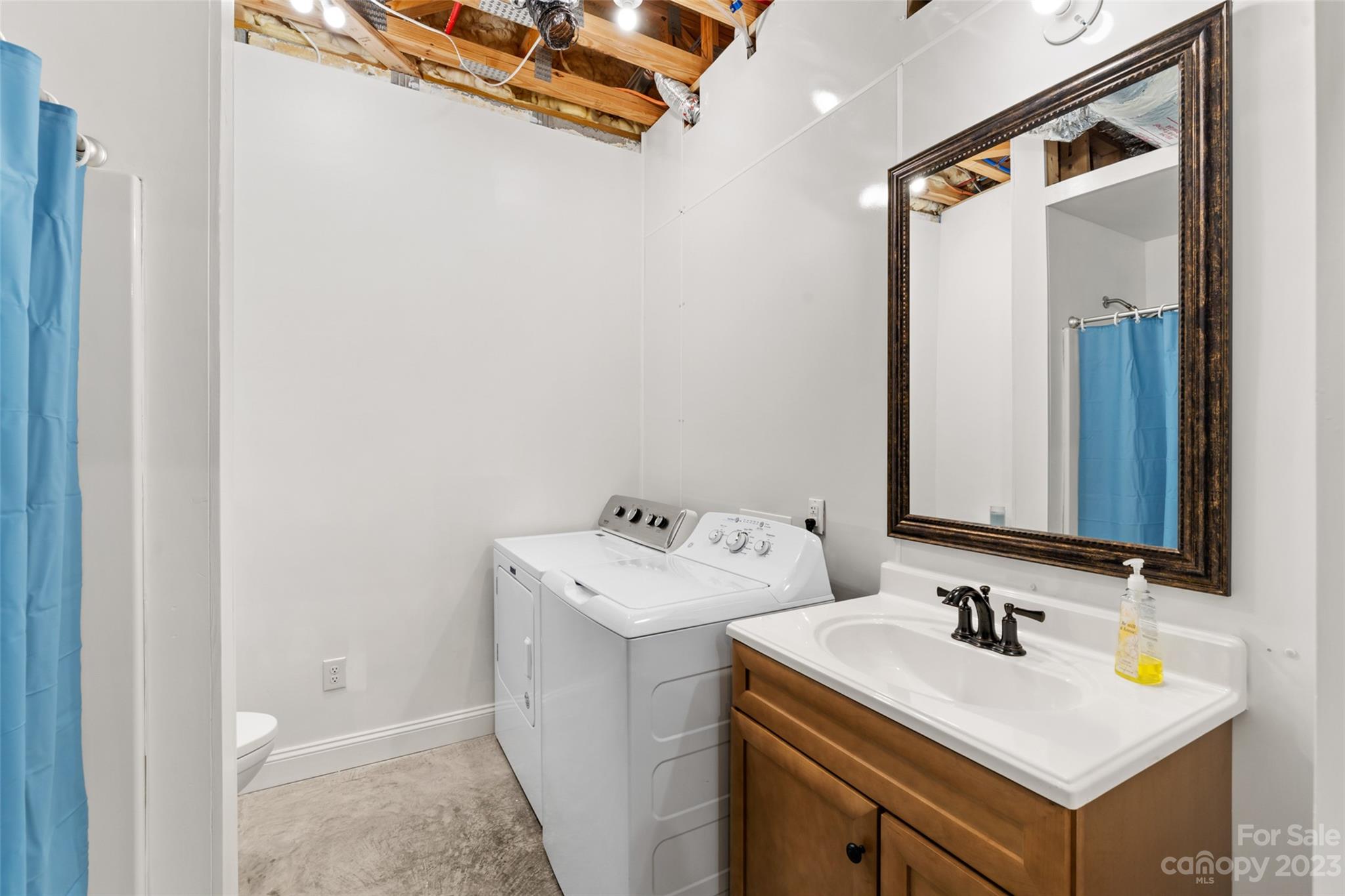6363 Cheatham Ford Road Hiddenite, NC 28636 - Photo 23 of 32 a bathroom with a sink and a mirror