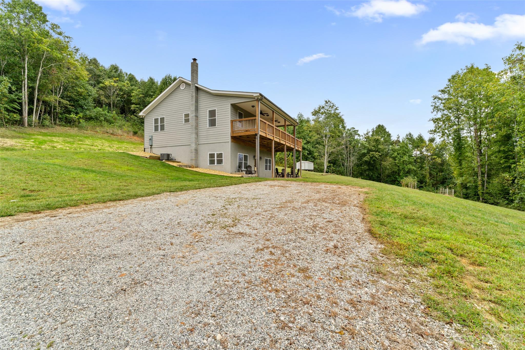 6363 Cheatham Ford Road Hiddenite, NC 28636 - Photo 29 of 32 a front view of a house with a yard