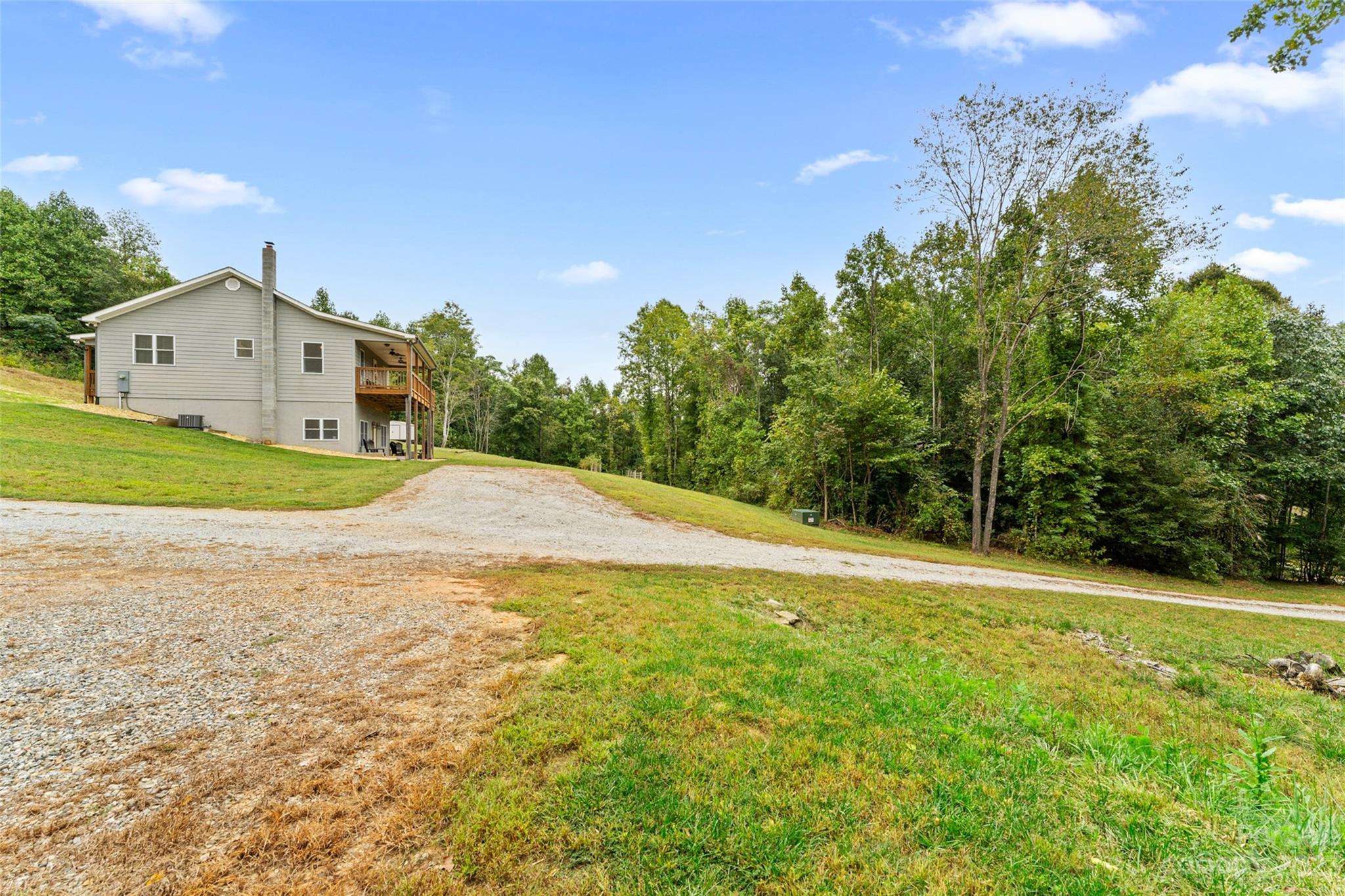 6363 Cheatham Ford Road Hiddenite, NC 28636 - Photo 31 of 32 a view of a house with a outdoor space