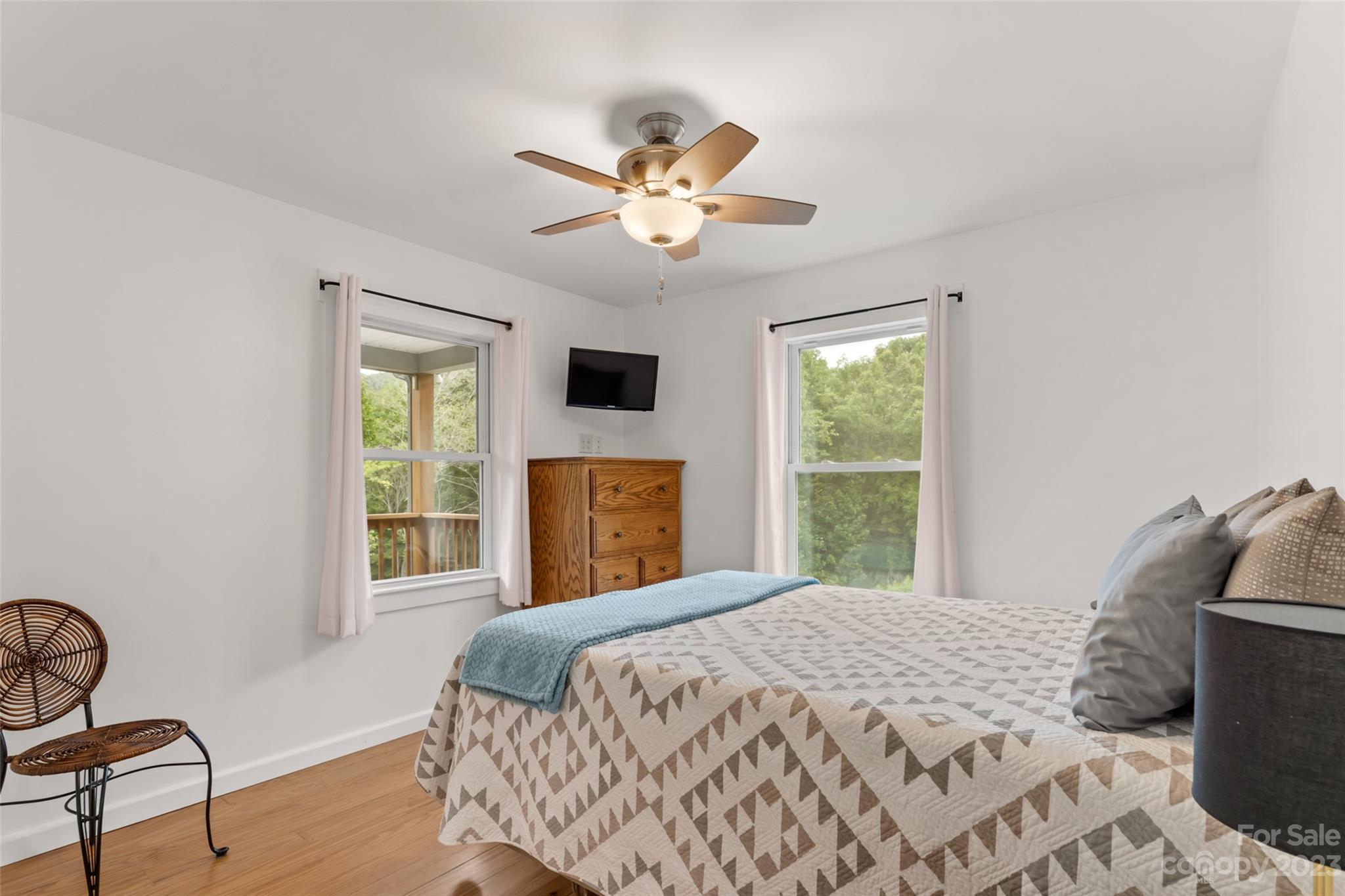 6363 Cheatham Ford Road Hiddenite, NC 28636 - Photo 5 of 32 a bedroom with a bed and a window