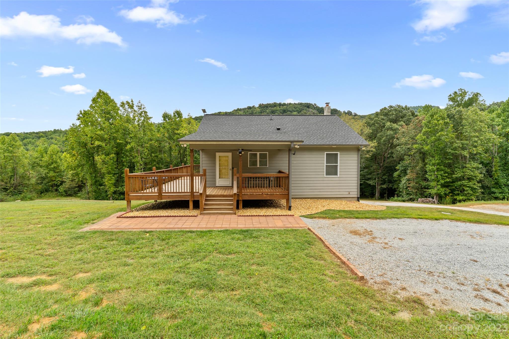 6363 Cheatham Ford Road Hiddenite, NC 28636 - Photo 7 of 32 a front view of a house with a yard