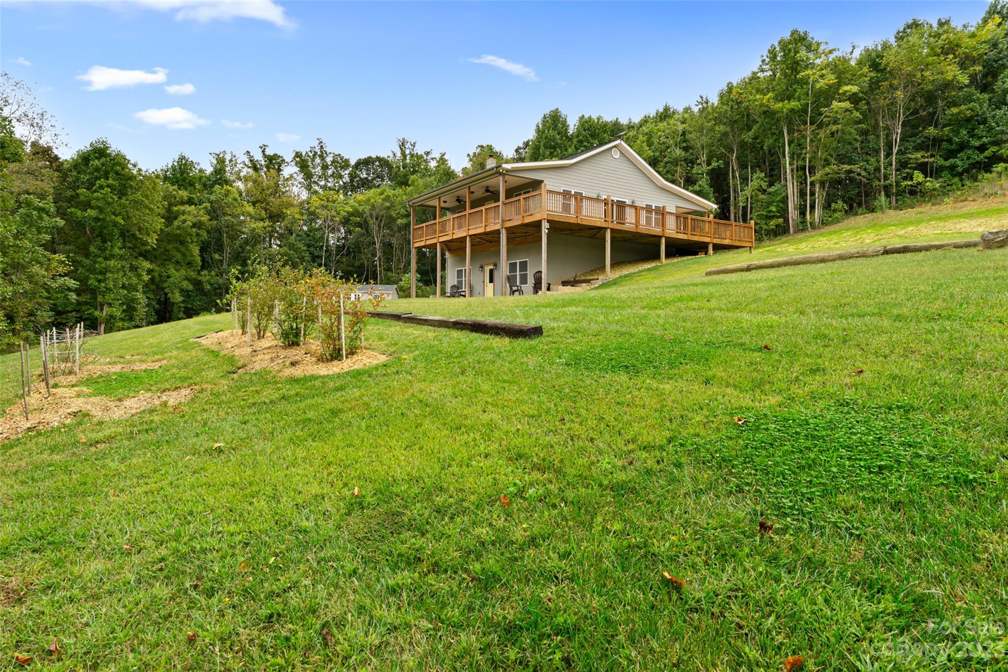 6363 Cheatham Ford Road Hiddenite, NC 28636 - Photo 8 of 32 a front view of a house with a yard