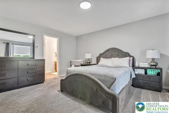 a bathroom with a toilet a sink and a mirror