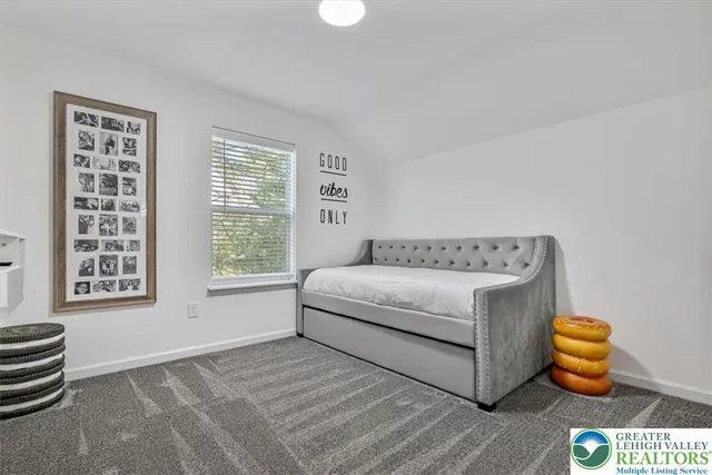 an aerial view of a house with a yard basket ball court and outdoor seating
