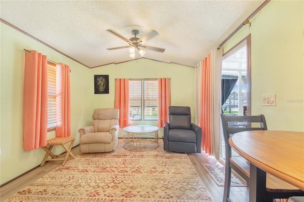 475 Pine Loop Frostproof, FL 33843 - Photo 8 of 40 a living room with furniture and a large window