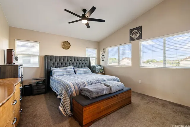 a bedroom with a bed and a television