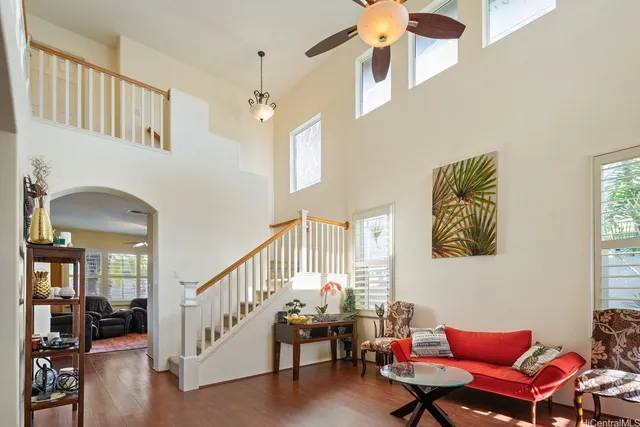 a living room with furniture and a chandelier