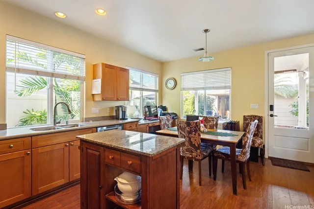 a kitchen with a stove a sink and a microwave
